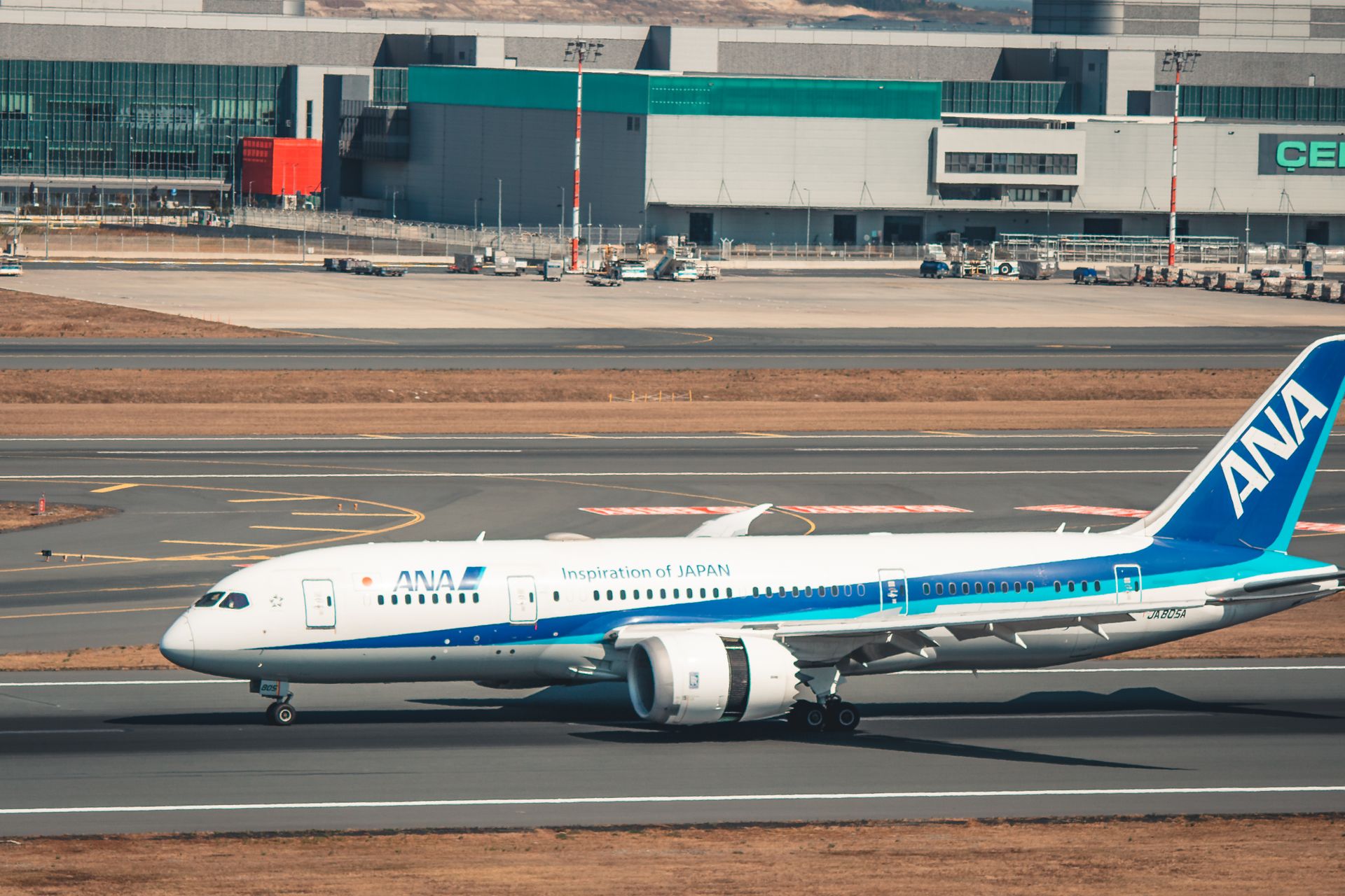 ANA Boeing 787 Dreamliner taxiing at Istanbul Airport on a clear day.
