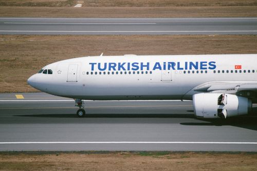 Free A Turkish Airlines plane taxiing on the runway in İstanbul, Türkiye. Stock Photo