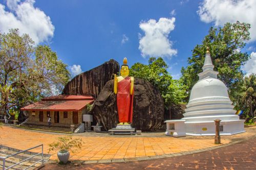 Free Buddhist temple with giant Buddha statue in Unawatuna, Southern Sri Lanka, a popular spiritual site. Stock Photo