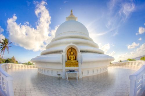 Free A breathtaking view of the Peace Pagoda in Unawatuna, Sri Lanka under a vibrant blue sky. Stock Photo