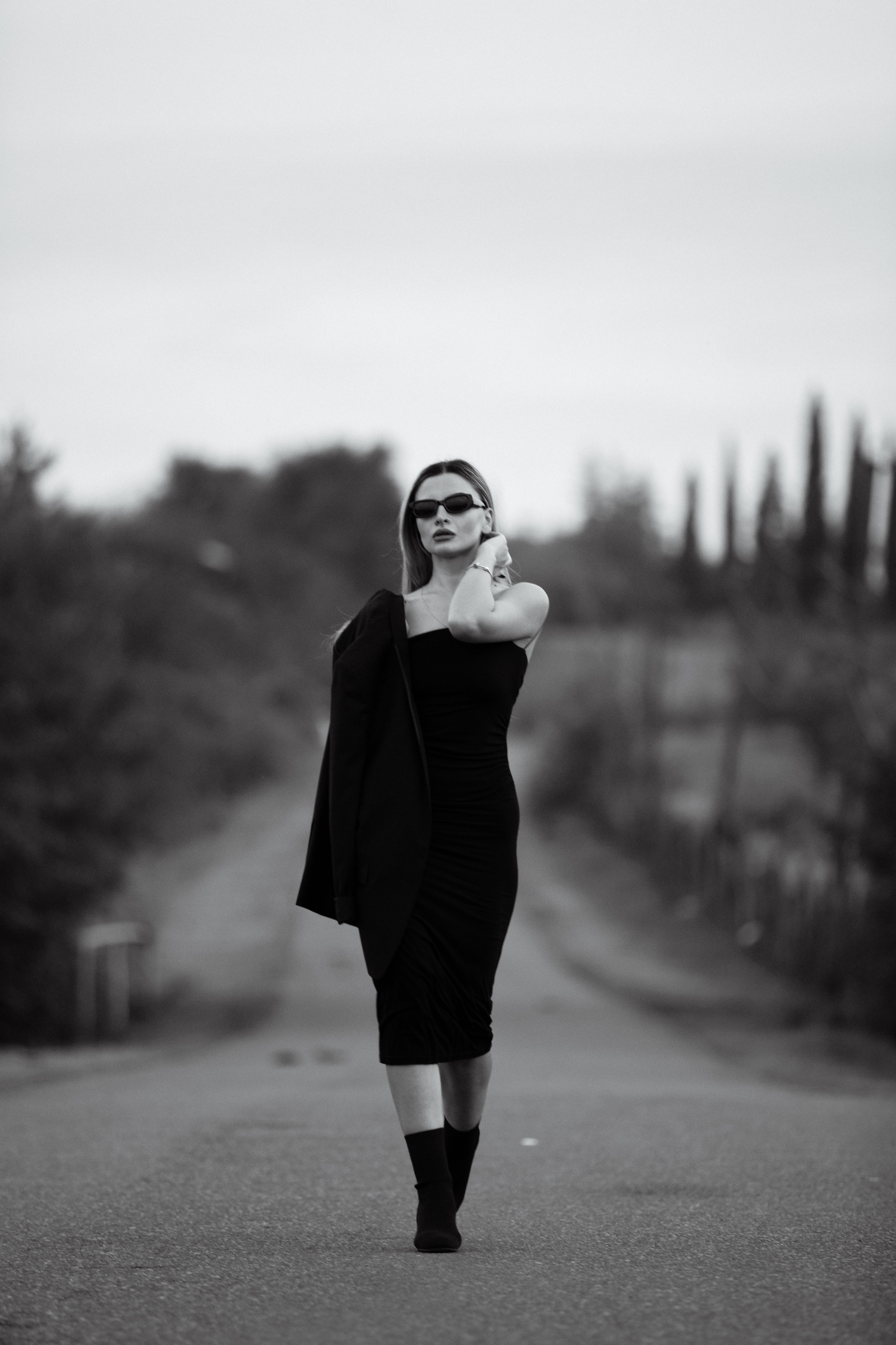 Elegant Woman Posing in Black Dress Outdoors  Free Stock Photo