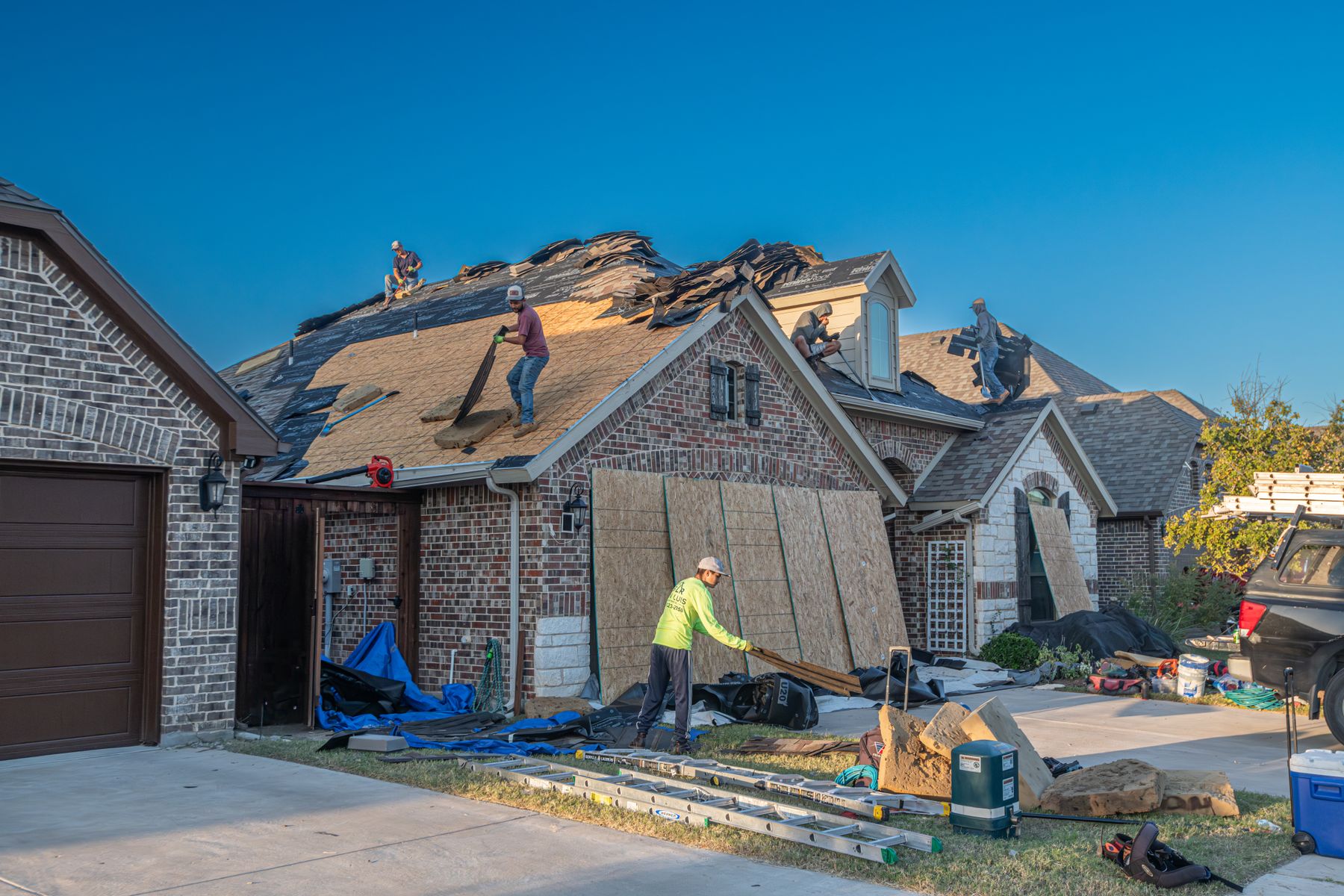 Roofing crew working on a residential roof