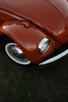 Close-up of a classic orange Volkswagen Beetle in São José do Rio Preto, Brazil.