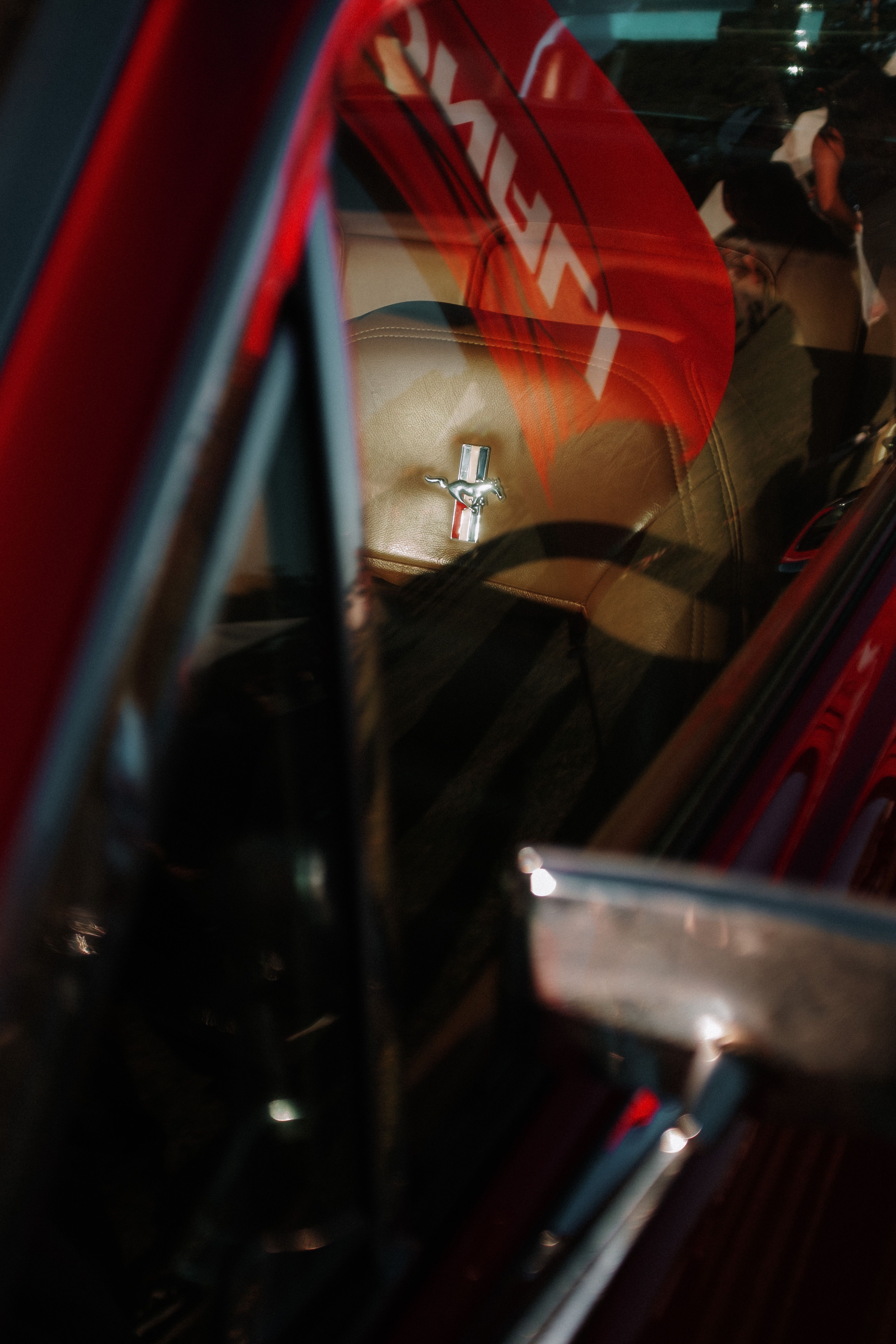 Close-up of a red Ford Mustang's interior taken in São José do Rio Preto, Brazil.