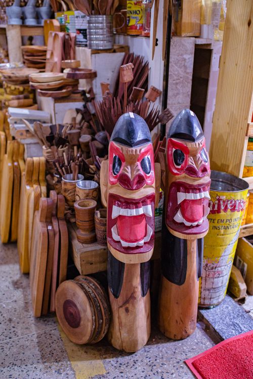 Free Vibrant wooden masks and handcrafted items in a Montes Claros market. Stock Photo