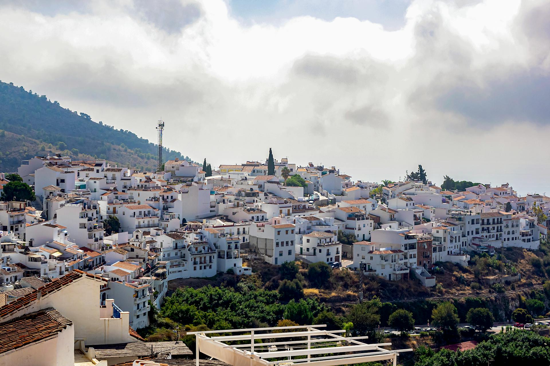 Amazing scenery of small southern town located in grassy hilly Andalusia region in daylight