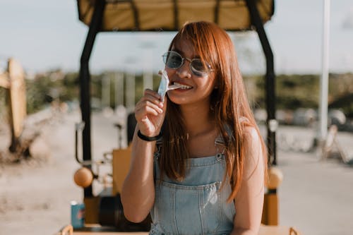 Free Woman Eating Candy Stock Photo