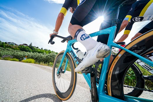 Cyclists in action during a sunny road race through scenic Bursa, Türkiye.