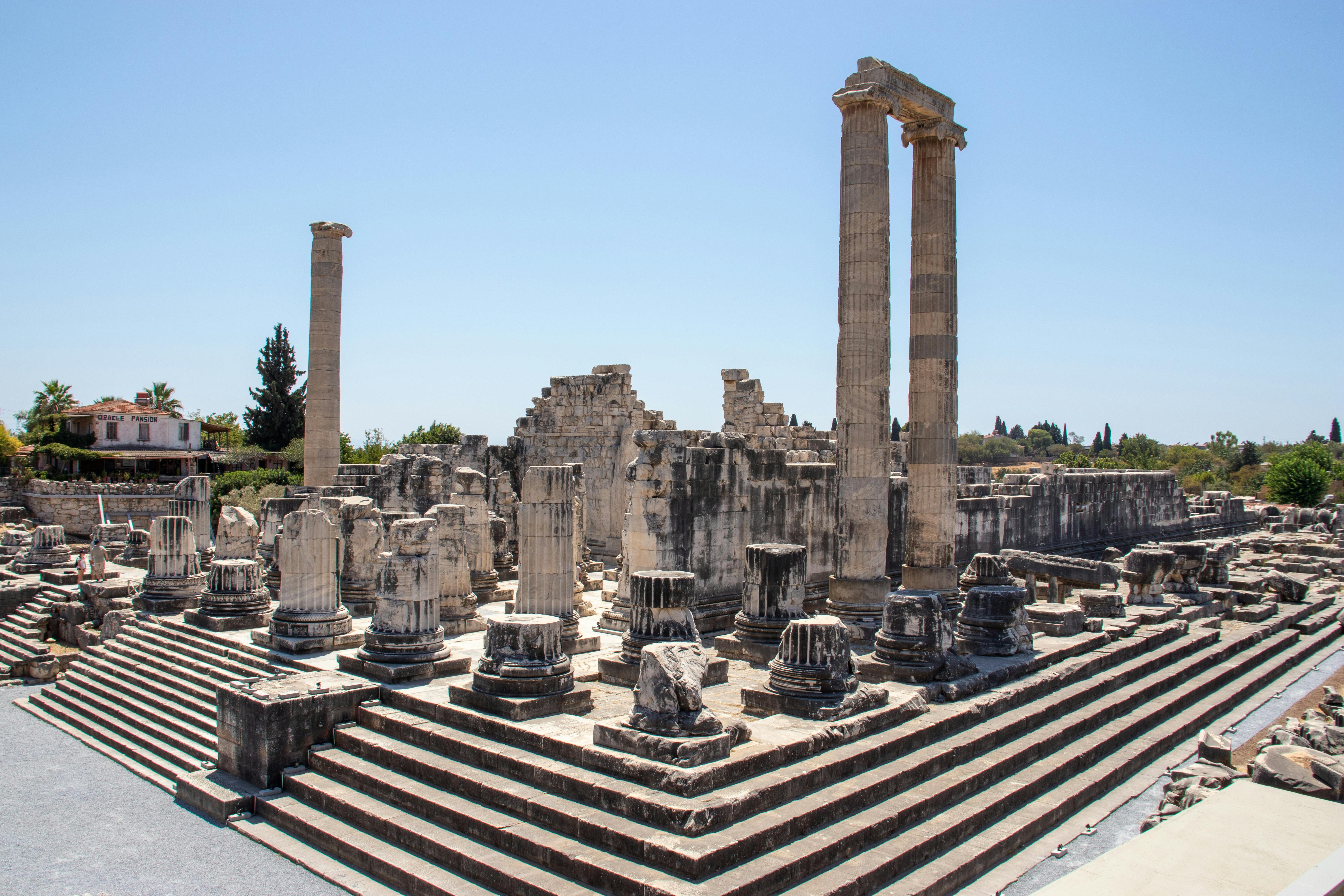 Colossal Ionic columns of Temple of Apollo at Didyma at golden hour, Aydın, Turkey, ancient oracle sanctuary with Mediterranean landscape backdrop