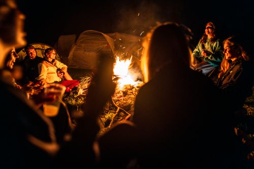 Free A cozy group campfire scene with friends enjoying a night outdoors in Schilpario, Lombardia, Italy. Stock Photo