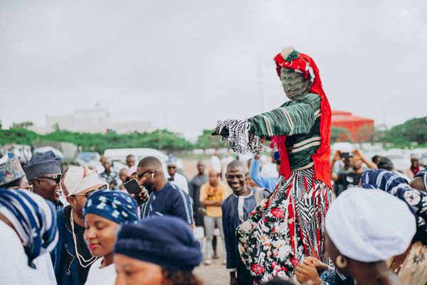 A lively Nigerian cultural festival crowd in Abuja, dressed in traditional attire