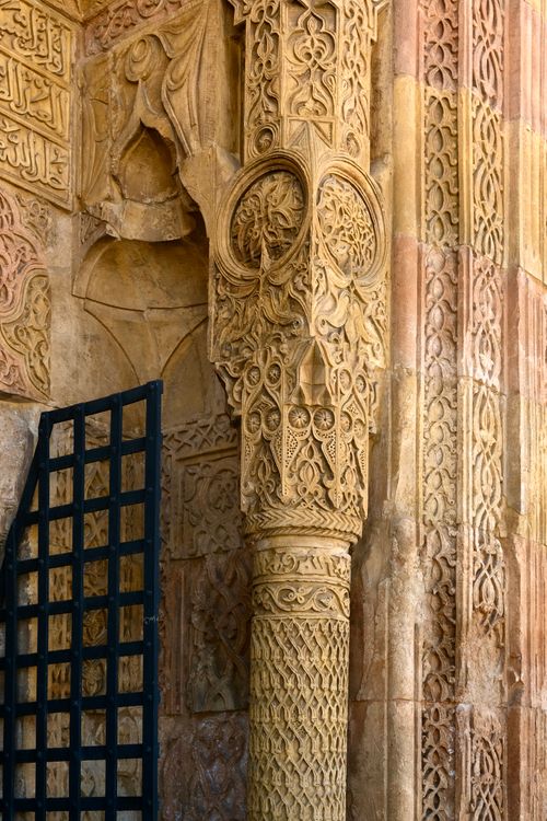 Free Close-up of an ornate stone carving on an ancient wall showcasing detailed craftsmanship. Stock Photo