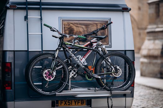 Two mountain bikes secured on a camper for travel or outdoor exploration. Perfect setup for biking trips.