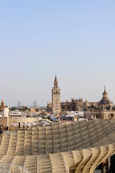 Panoramic view of Seville's historic skyline including the iconic Giralda Tower and Metropol Parasol.