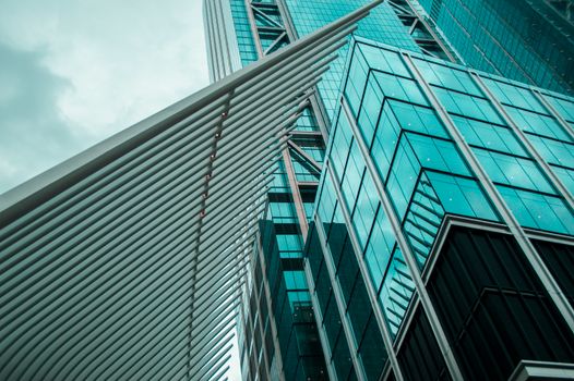 A striking modern skyscraper in New York City with steel and glass structure.