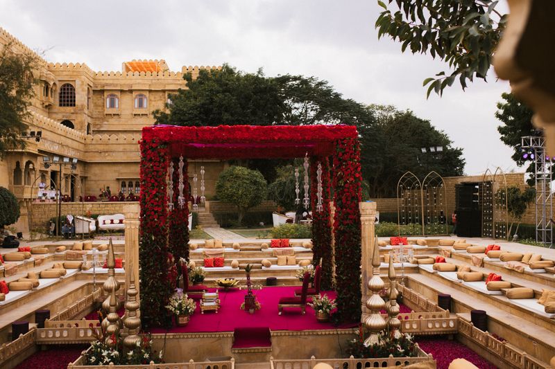 Opulent outdoor wedding venue with floral canopy