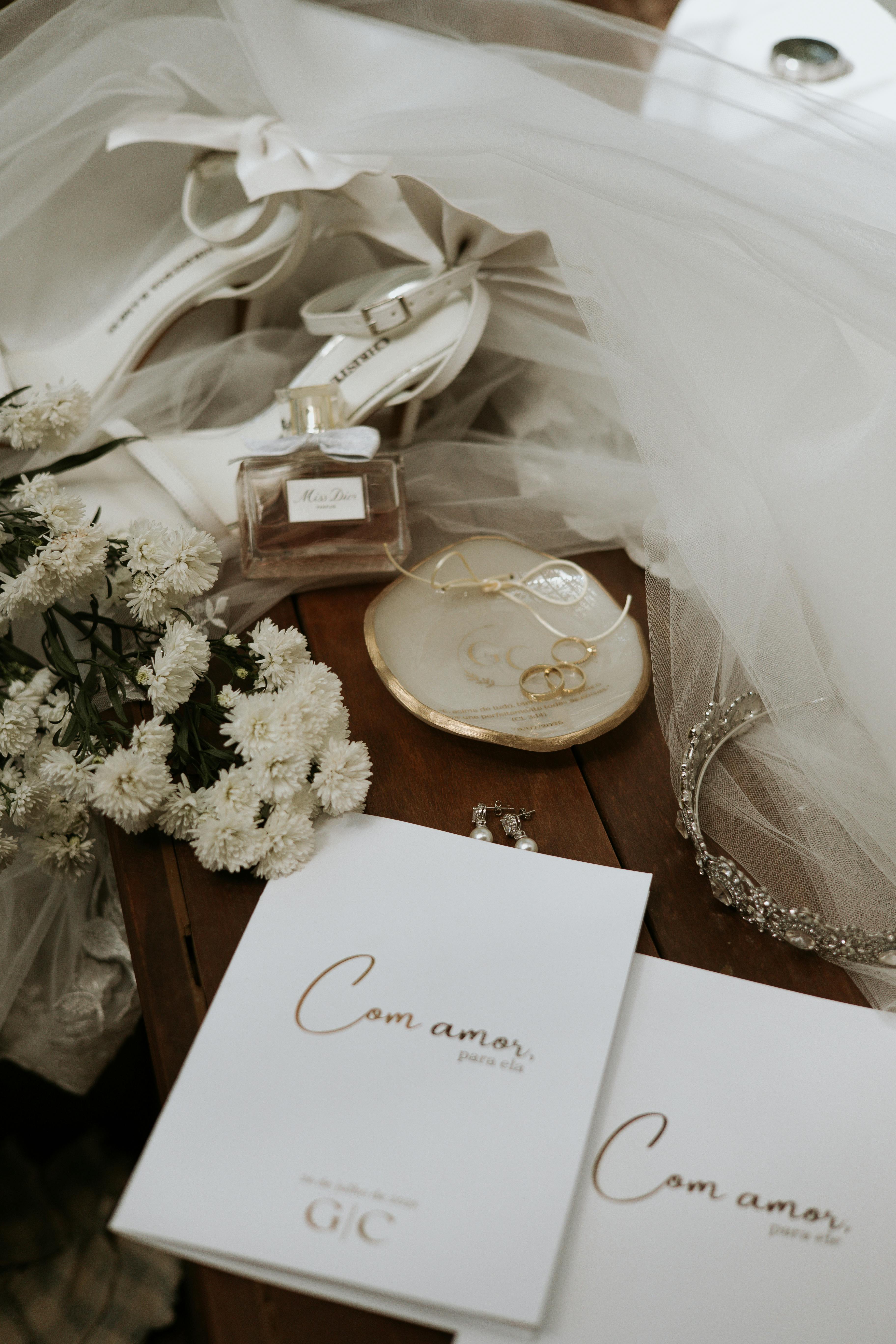 Stylish flat lay of bridal accessories with elegant wedding invitations.