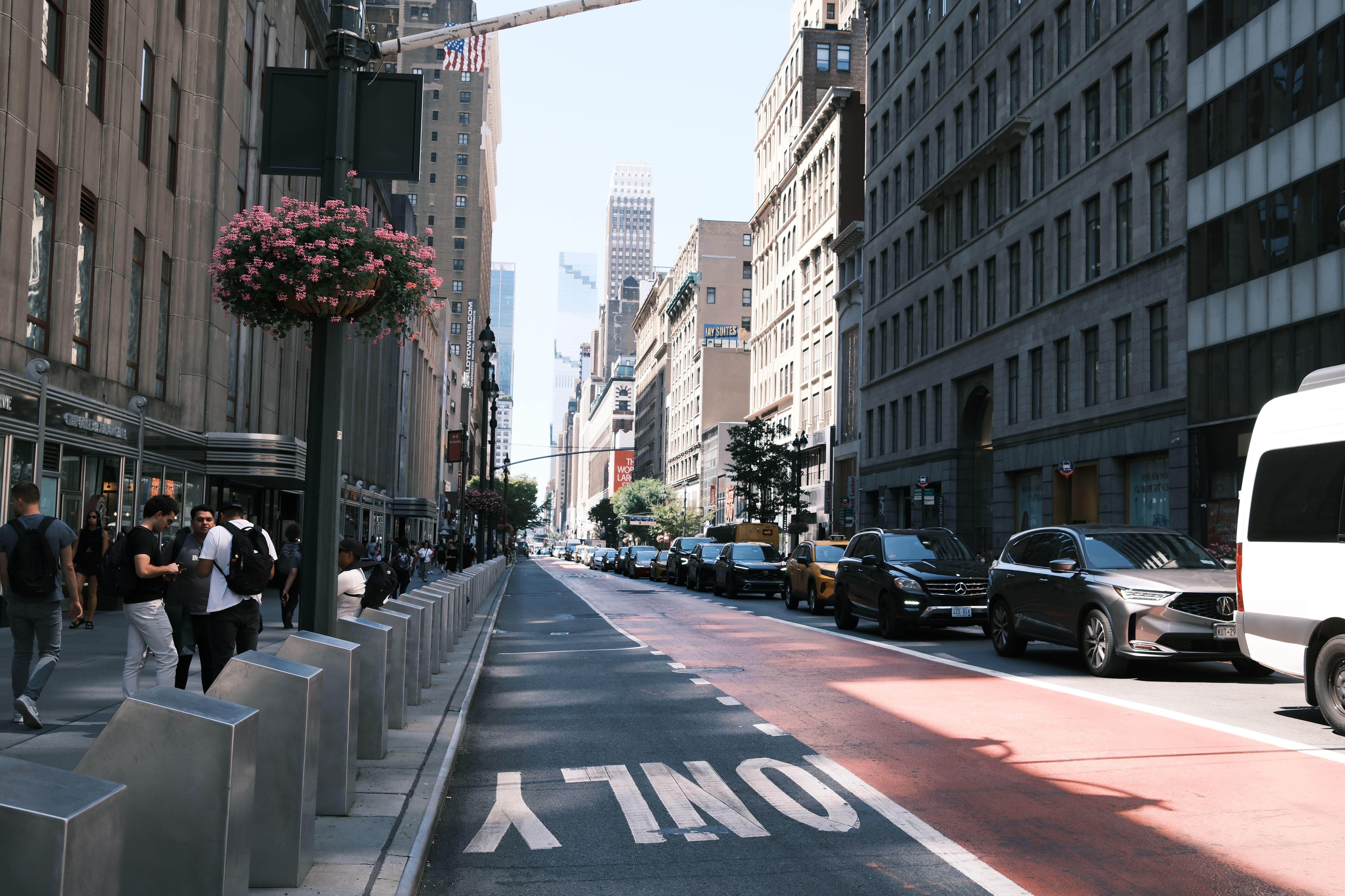 Contemporary New York street with pedestrians, city traffic and architectural depth