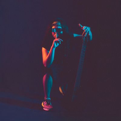 Neon-lit portrait of a musician — photo by Đức Trung Đào on Pexels