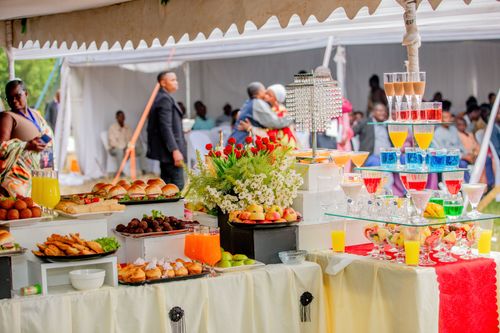 Free Colorful buffet arrangement with food and drink display at an outdoor gathering. Stock Photo
