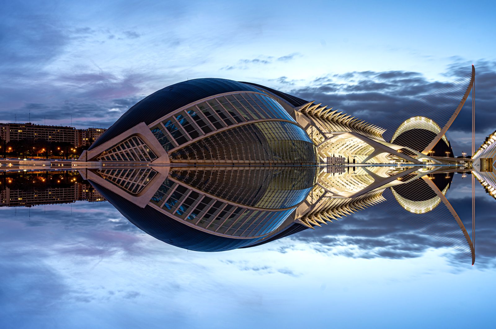 Stunning twilight view of Valencia's iconic City of Arts and Sciences with reflection.