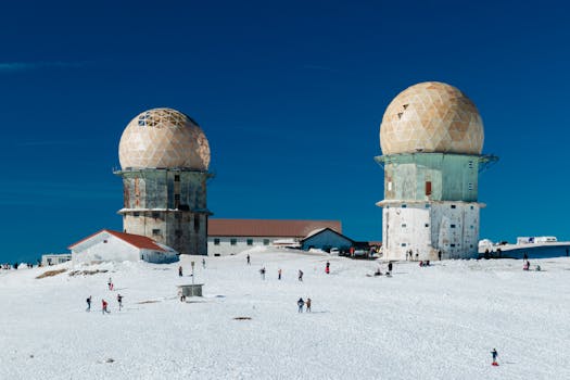 A winter scene featuring Serra da Estrela's observatory in snowy Distrito da Guarda, Portugal.