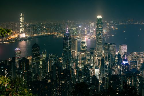 Free A breathtaking view of Hong Kong's illuminated skyline at night, showcasing iconic skyscrapers and waterfront. Stock Photo