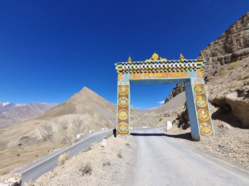 Free Colorful traditional gate in Spiti Valley with majestic mountains. Stock Photo