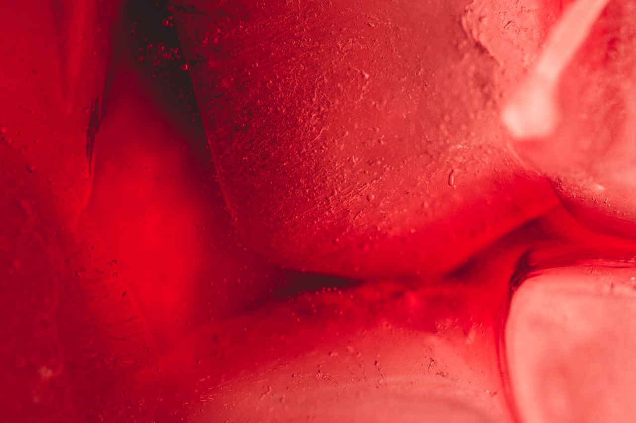 close up of a red textured abstract background creating a vibrant and