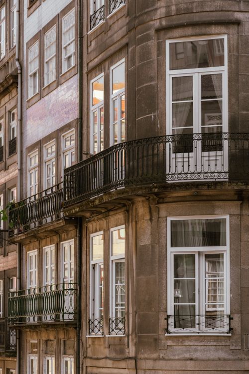 Free Charming historic building with elegant balconies and large windows in a European city. Stock Photo
