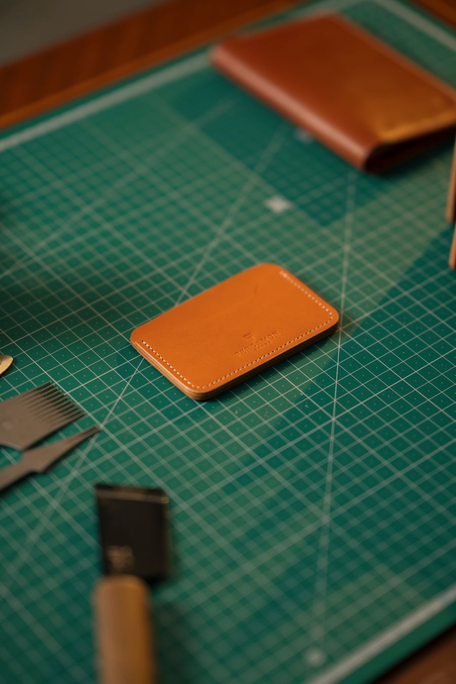 Leather crafting materials and tools prepared on a workbench