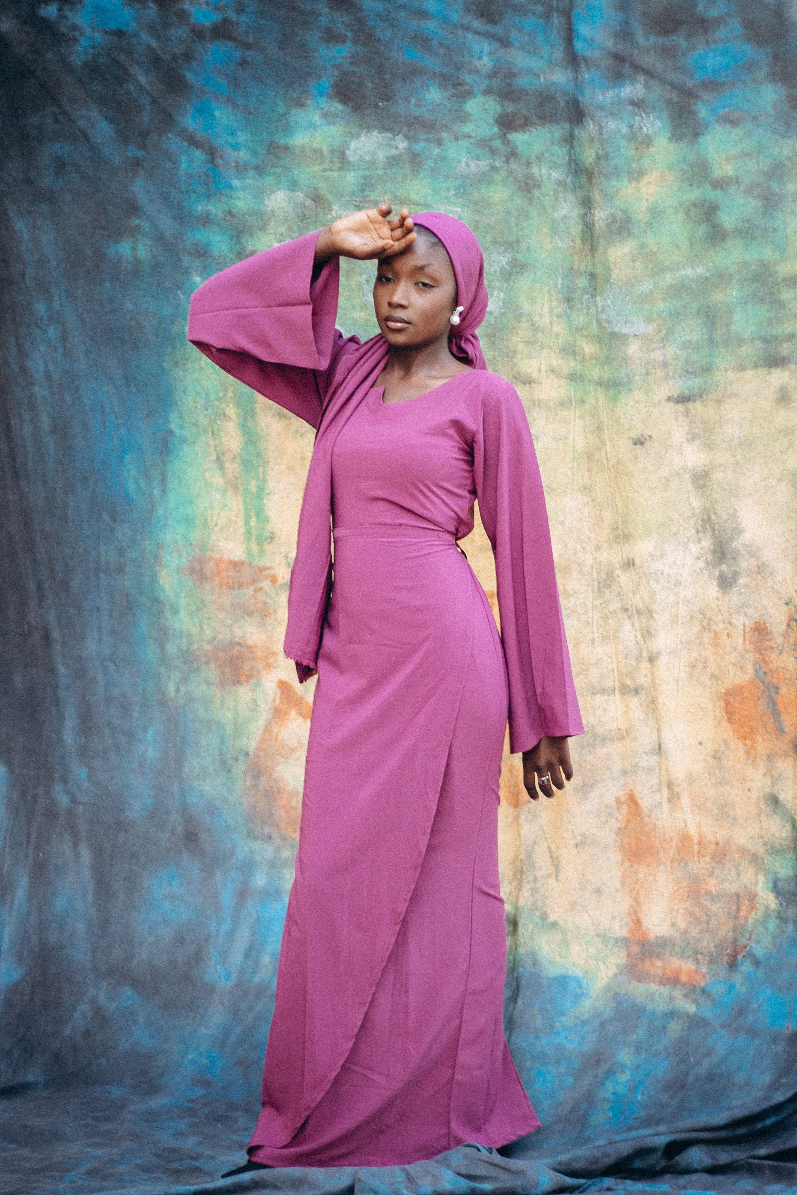 Elegant Woman Posing in Purple Dress · Free Stock Photo