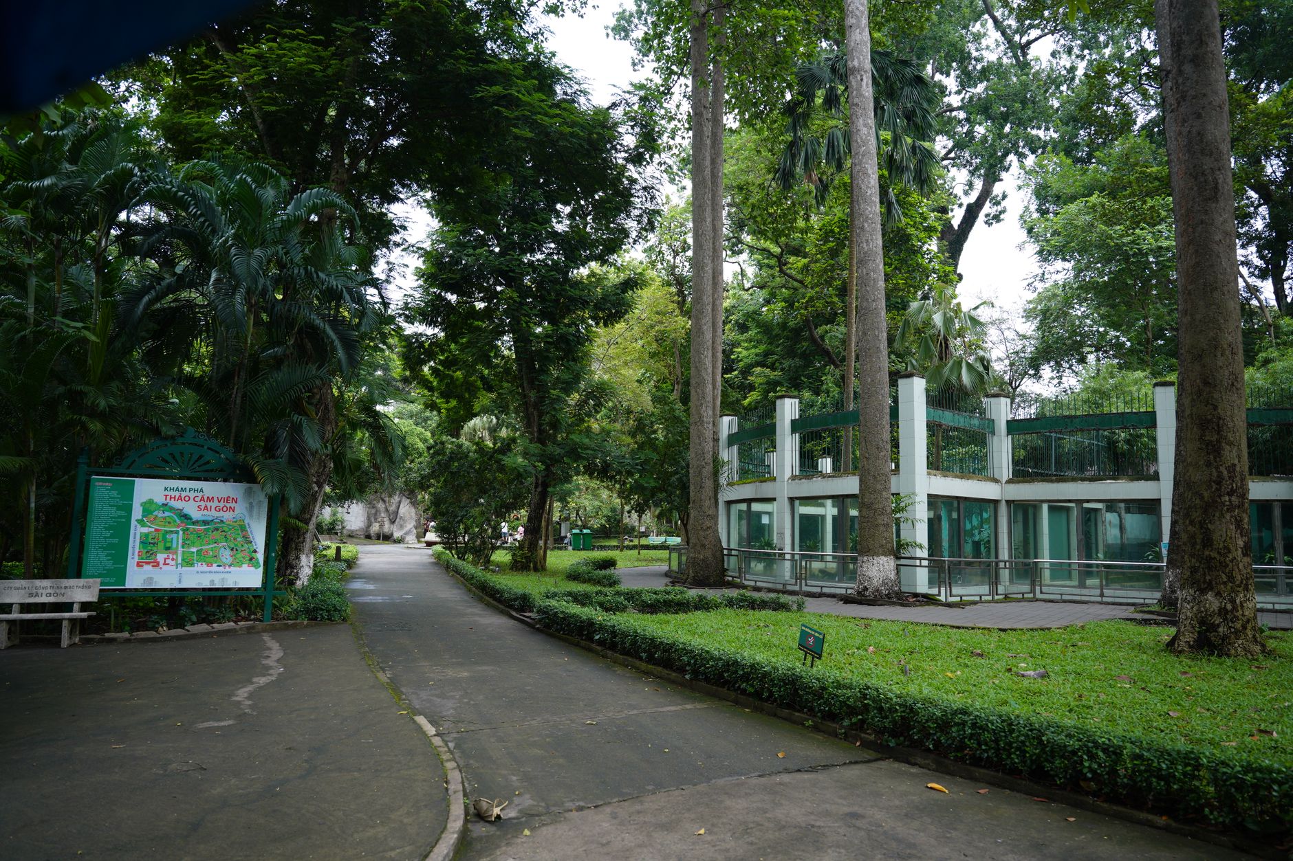 A serene path through the lush greenery of Saigon Zoo and Botanical Gardens, capturing nature's beauty.