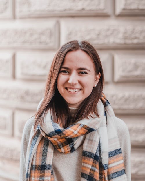 Photo of Woman Wearing Plaid Scarf