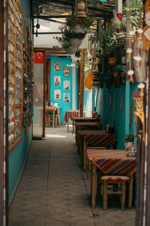 Free A narrow alleyway in Turkey showcasing vibrant decor and cultural charm, ideal for storytelling images. Stock Photo