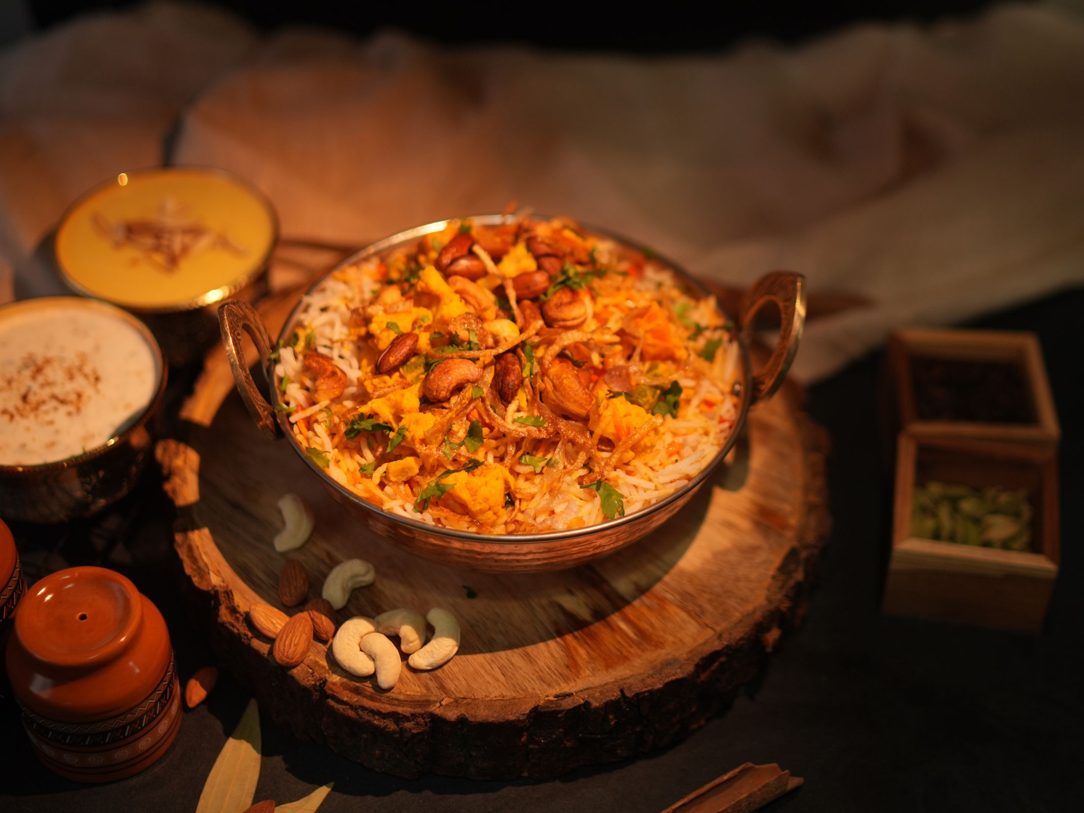 Indian biryani in a traditional serving bowl
