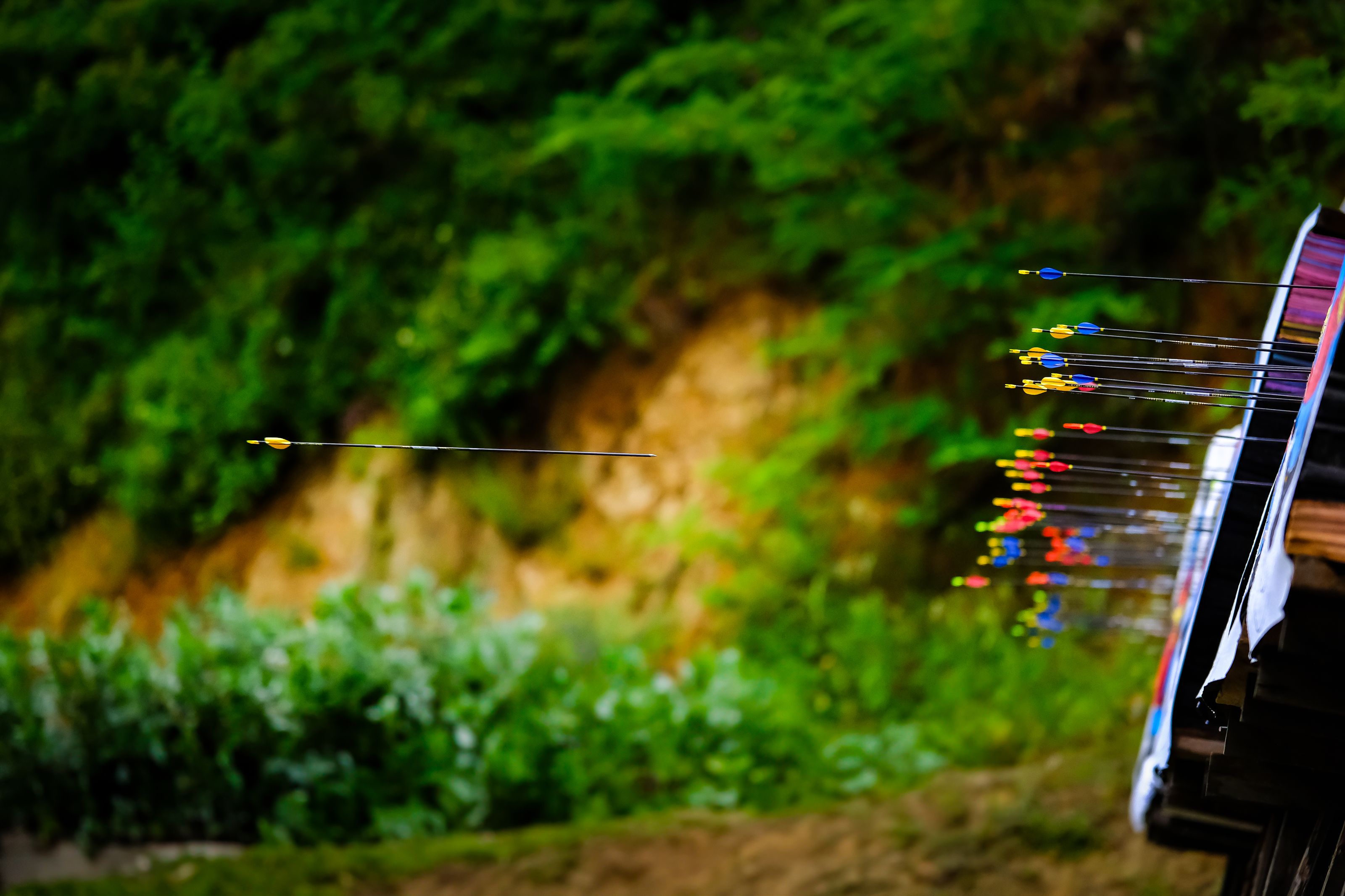 A vibrant scene of multiple arrows shot towards a target in İstanbul, Türkiye.