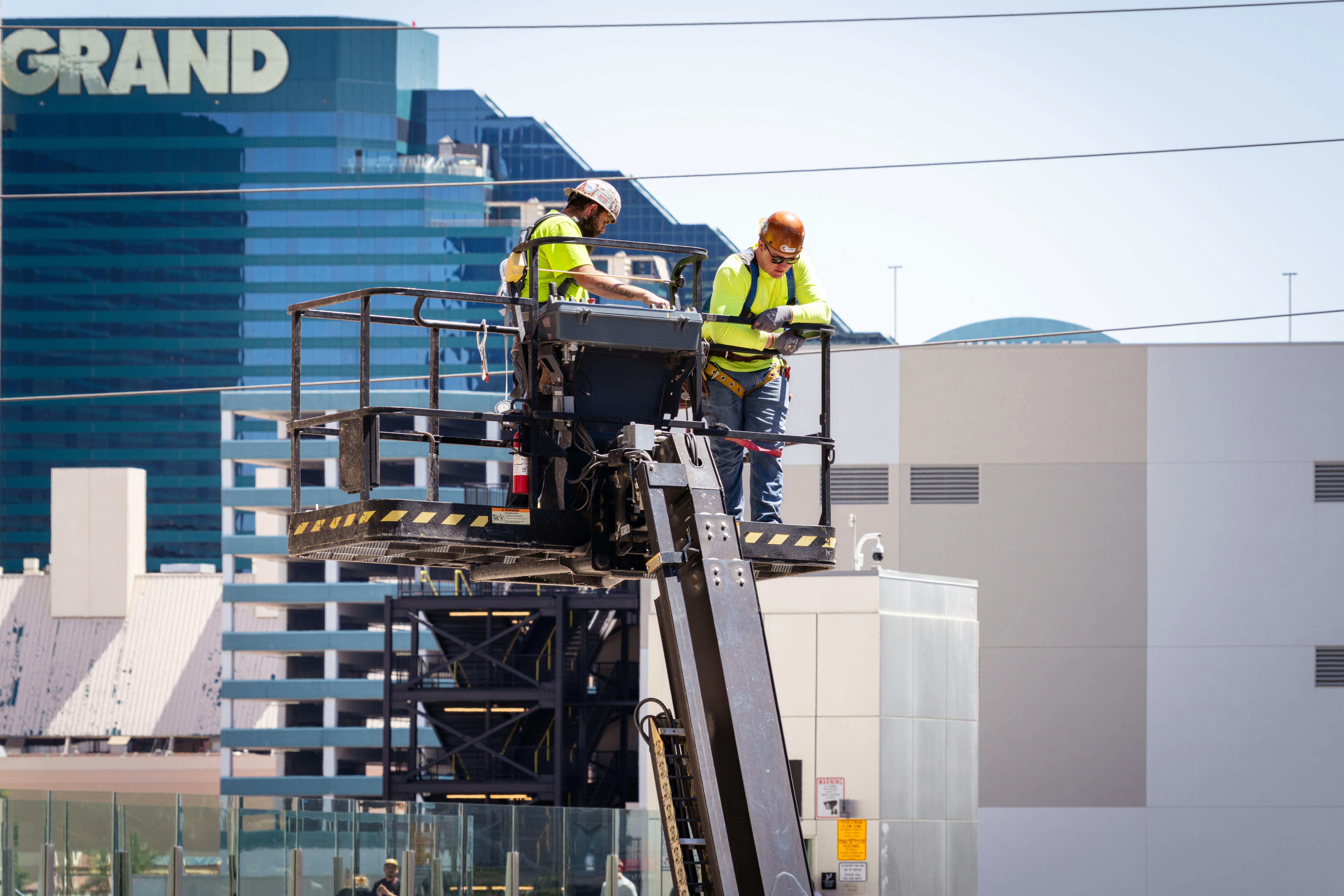 Construction workers perform exterior maintenance on a high-rise in Las Vegas.