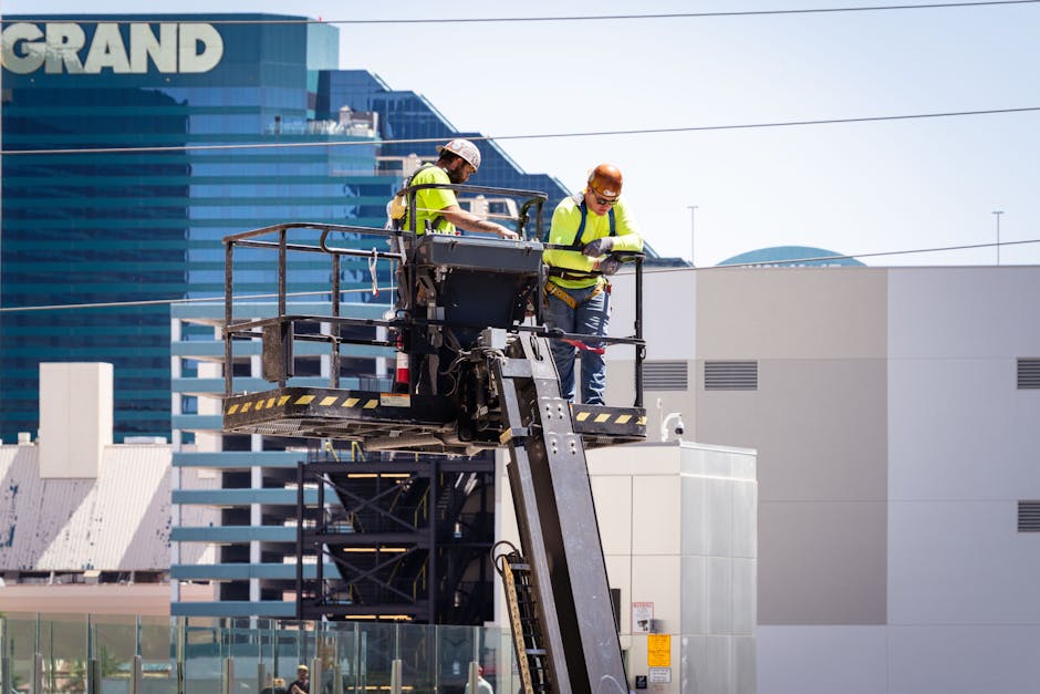 Construction workers perform exterior maintenance on a high-rise in Las Vegas.
