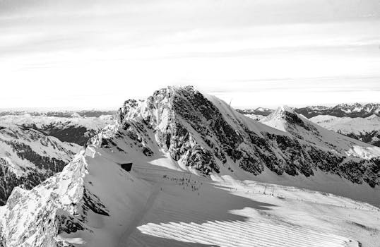 A stunning black and white aerial view of the Kitzsteinhorn summit in Salzburg, Austria.