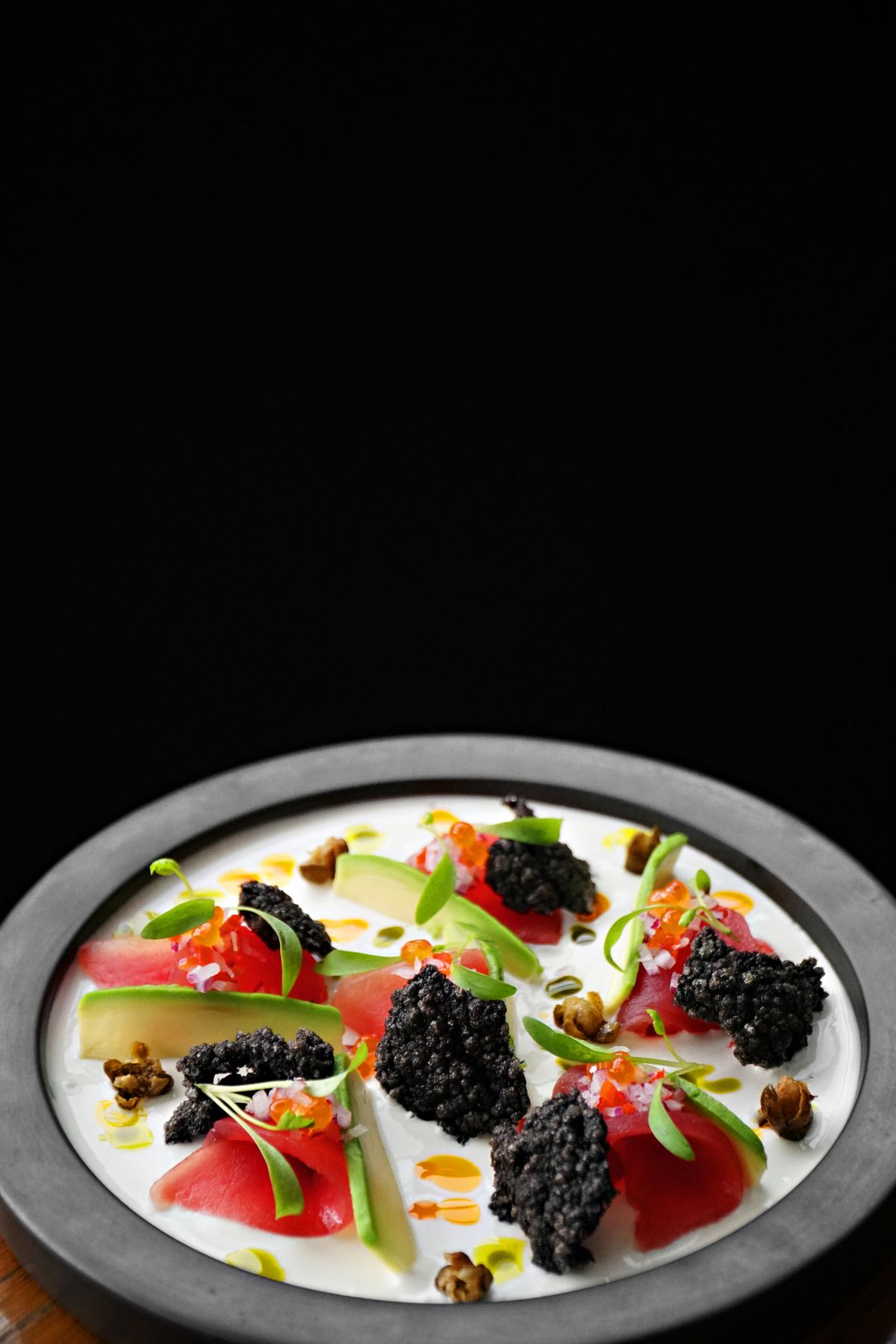 Easter brunch table setting with premium caviar centrepiece and spring flowers
