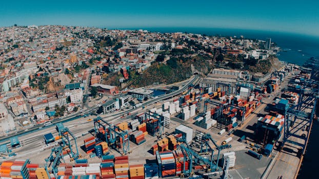 Explore a vibrant aerial view of Valparaíso, Chile, showcasing its bustling harbor and colorful hillside architecture.