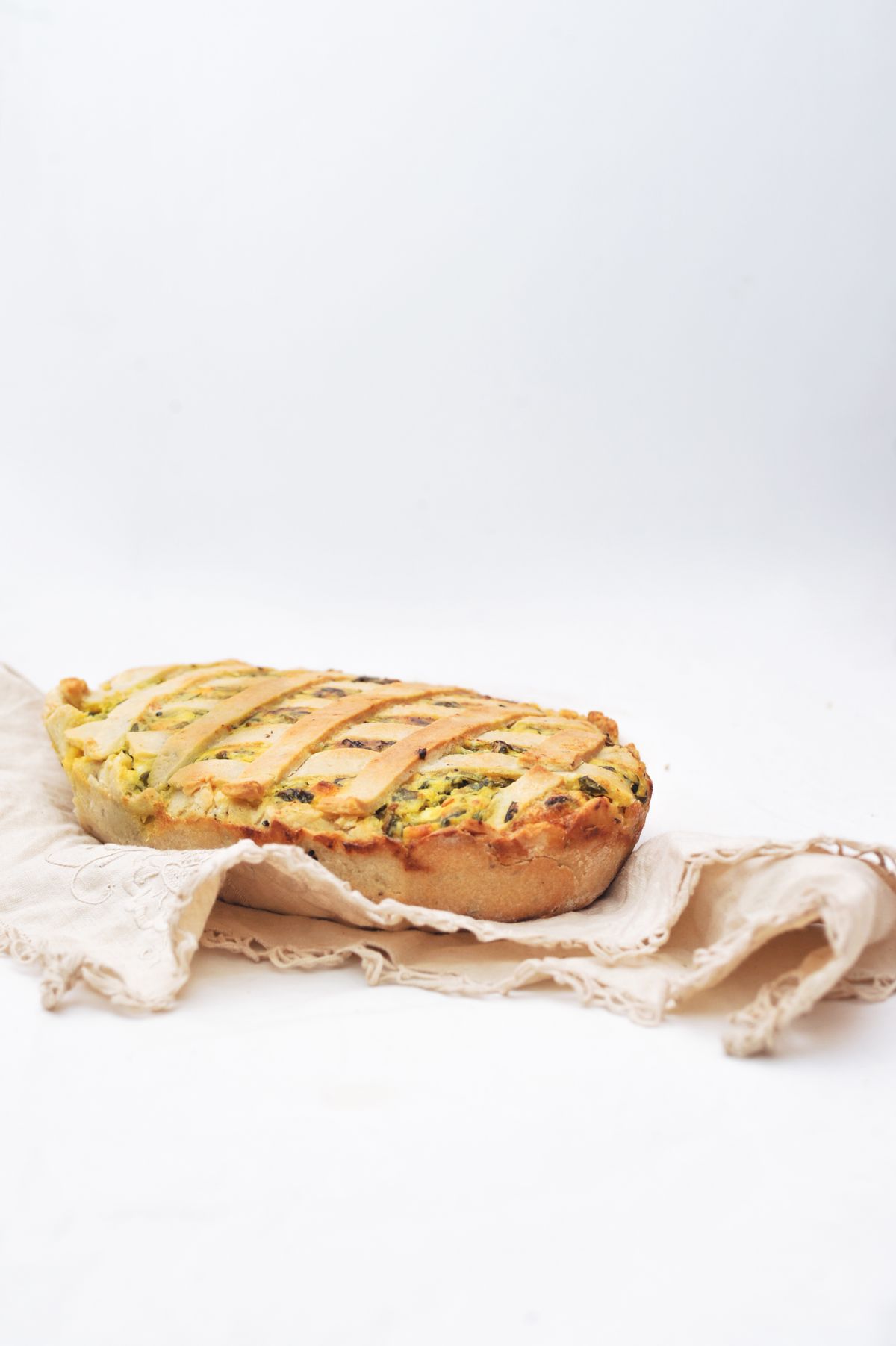 Homemade vegetable tart on a rustic linen cloth