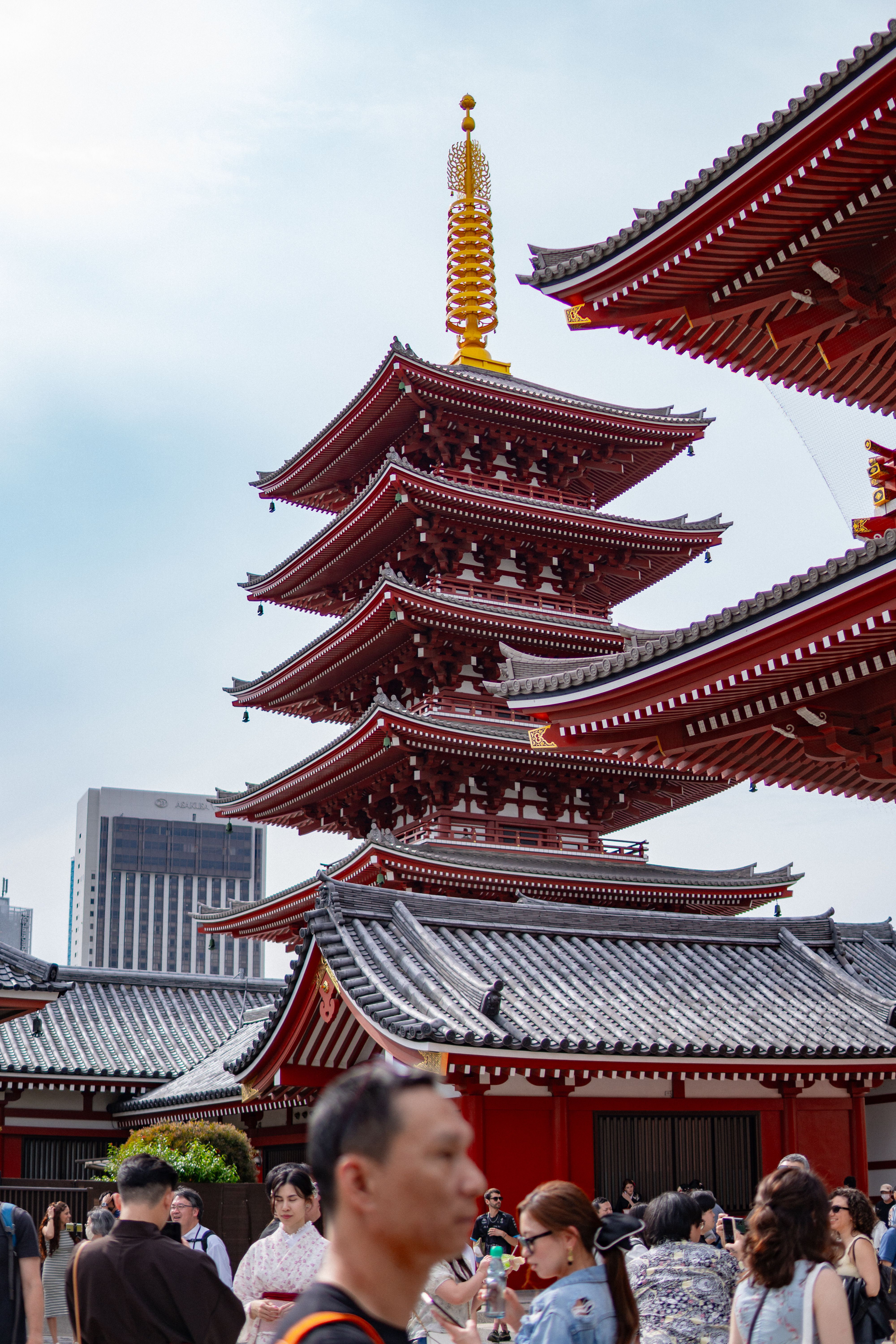 Vibrant day at Senso-ji Temple in Tokyo, capturing the pagoda and visiting crowd.