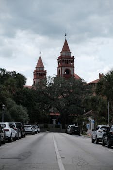 A cloudy day view of St. Augustine's historic architecture and city street.