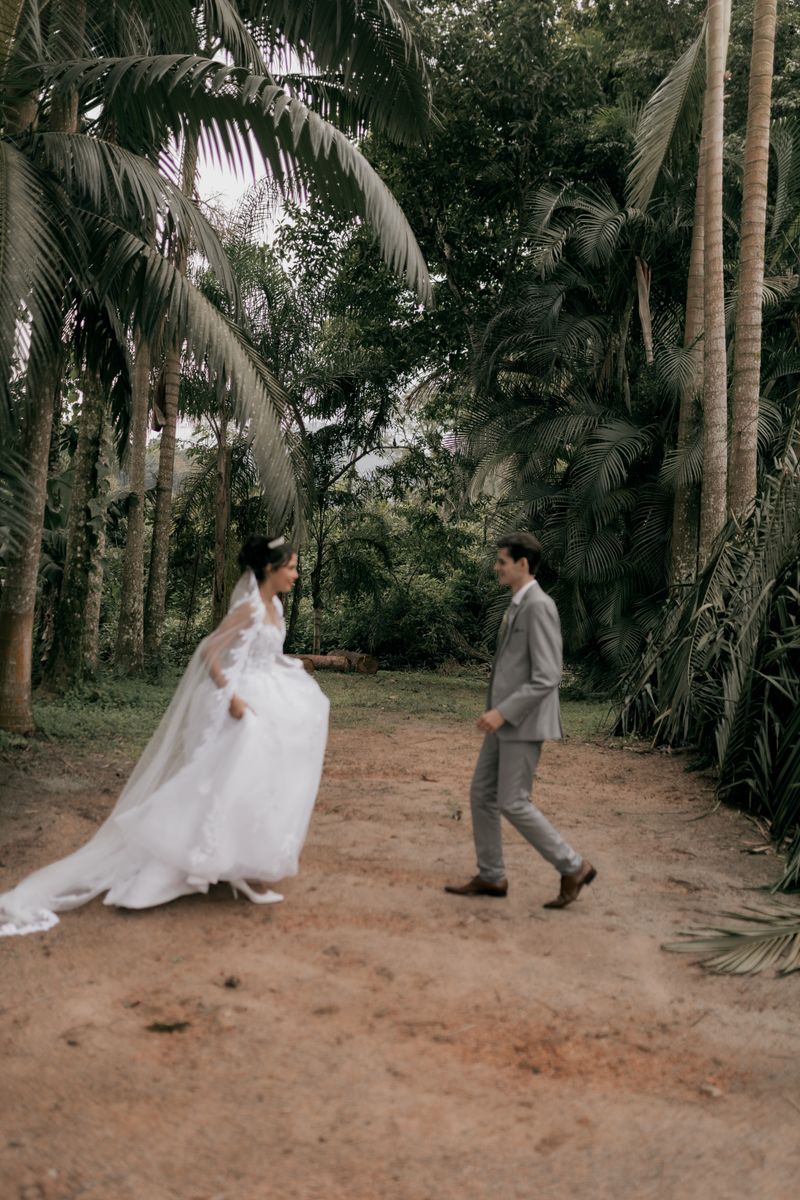 Outdoor wedding surrounded by tropical greenery