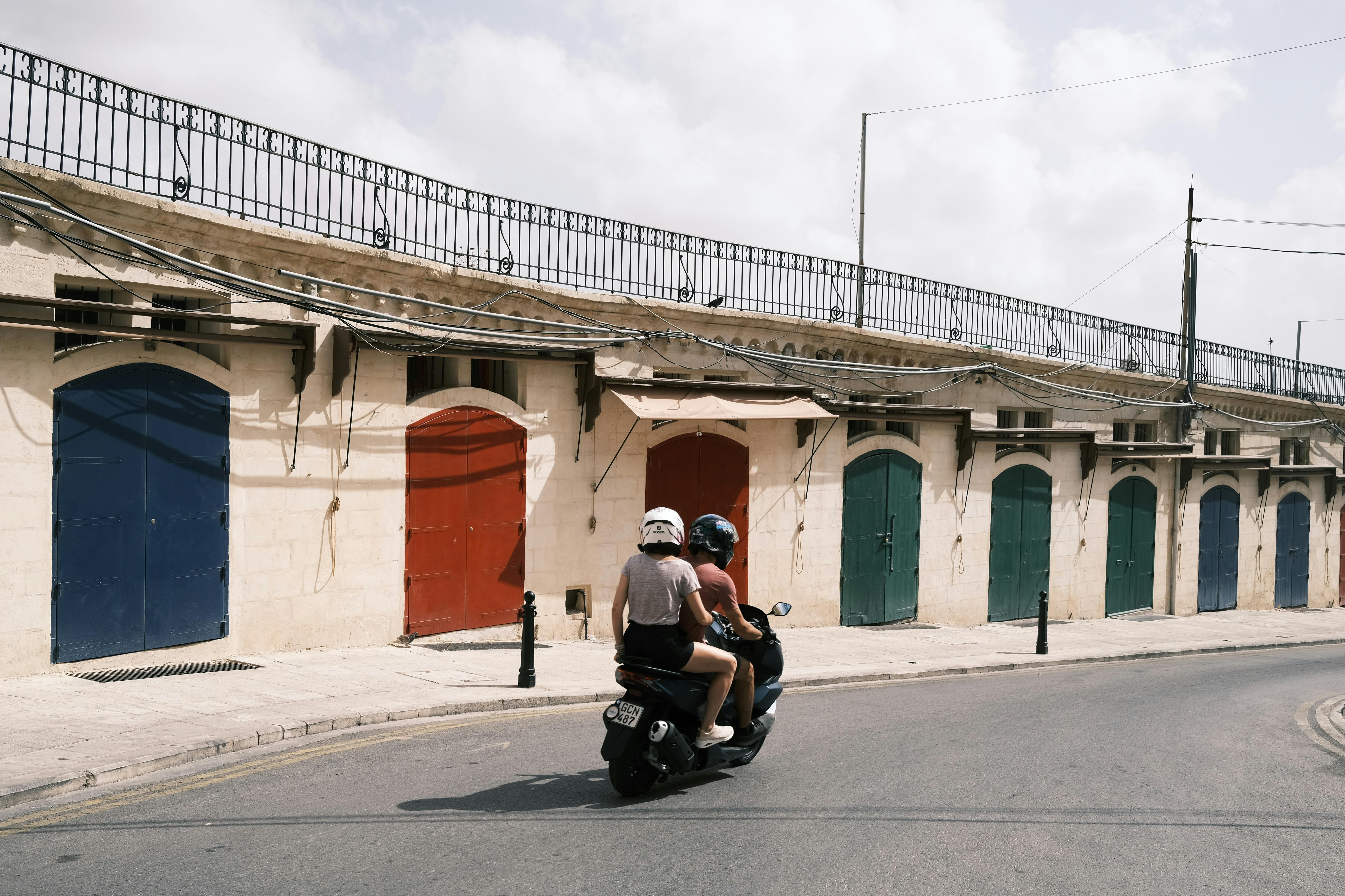 couple exploring colorful european street - cheap places for couples