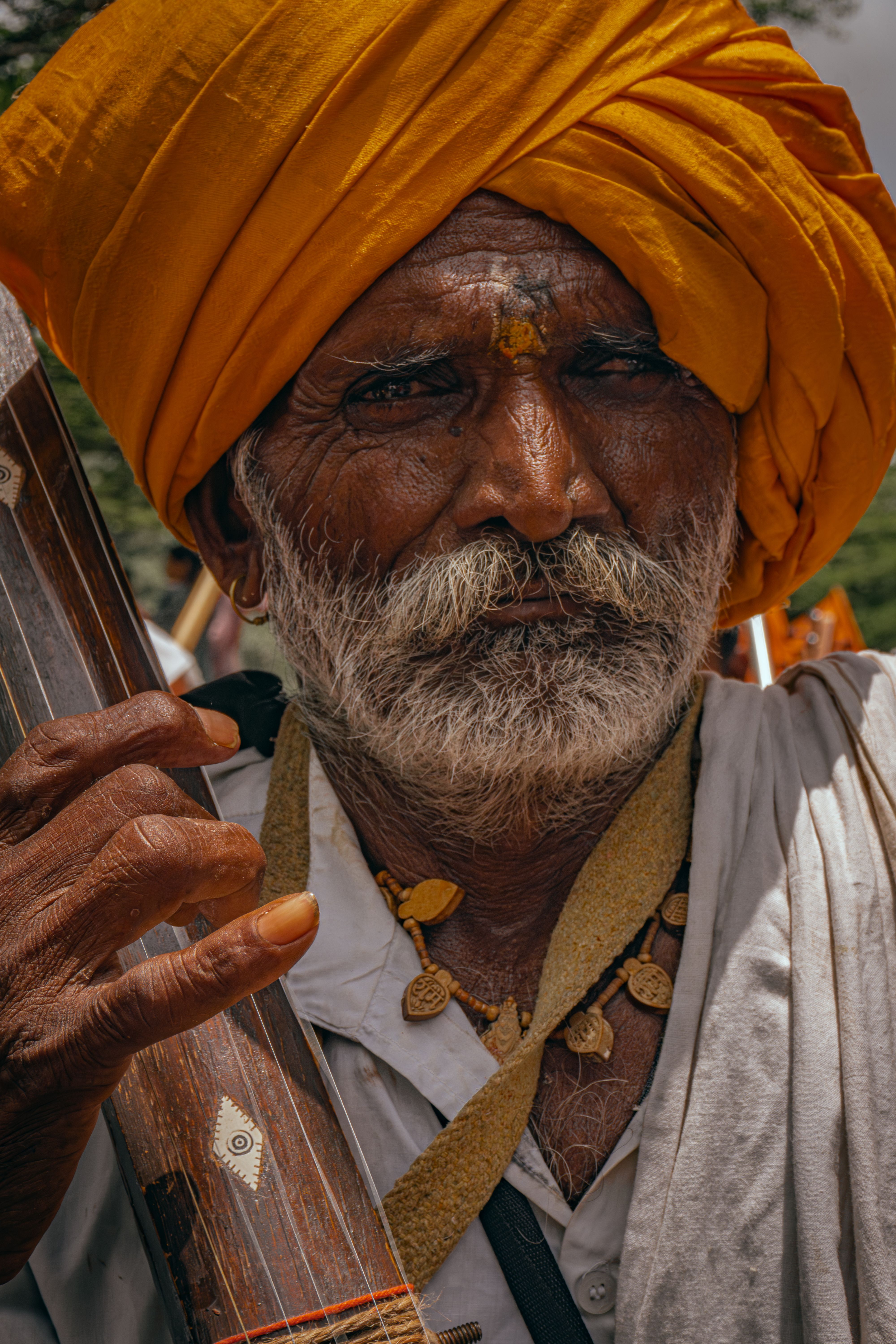 Elderly Man with Traditional Musical Instrument in Pune · Free Stock Photo