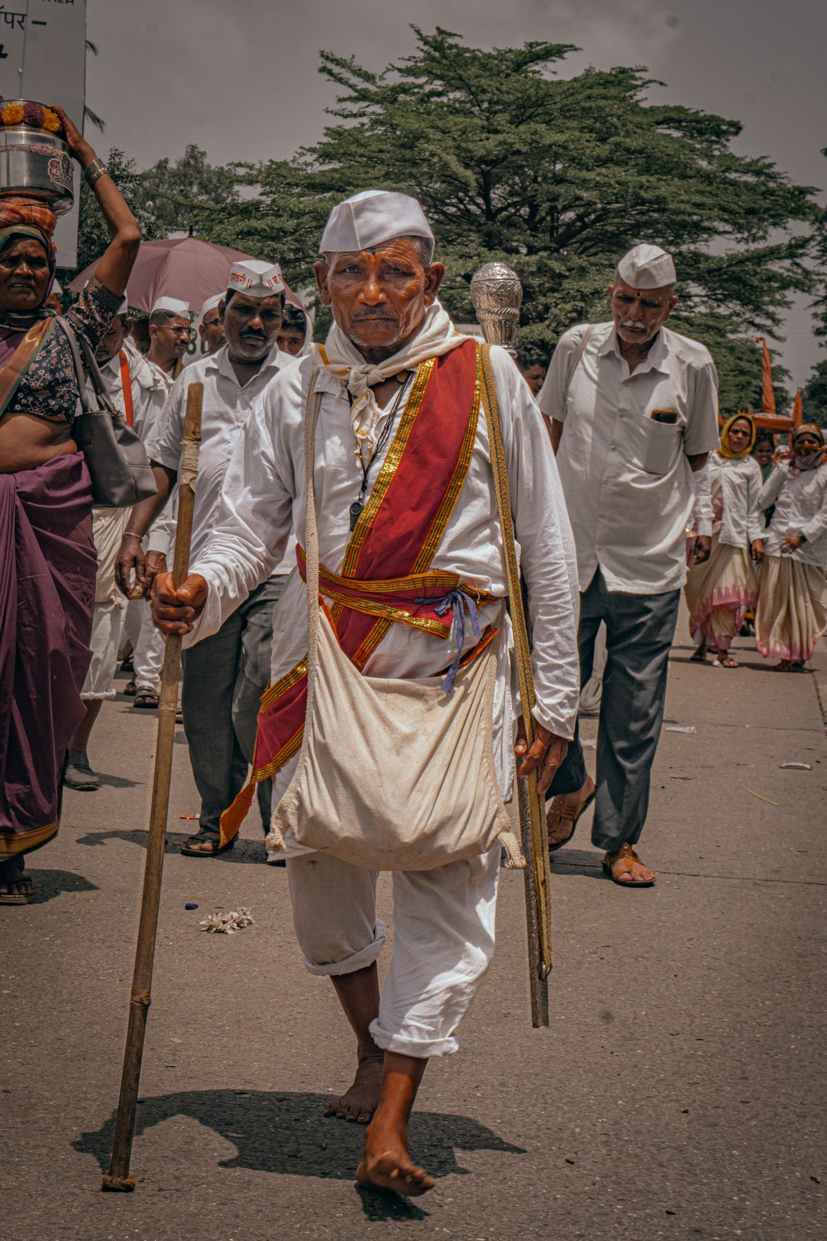 Devotees walking together during a Hindu pilgrimage procession, representing Deoghar's Baidyanath Dham pilgrim economy