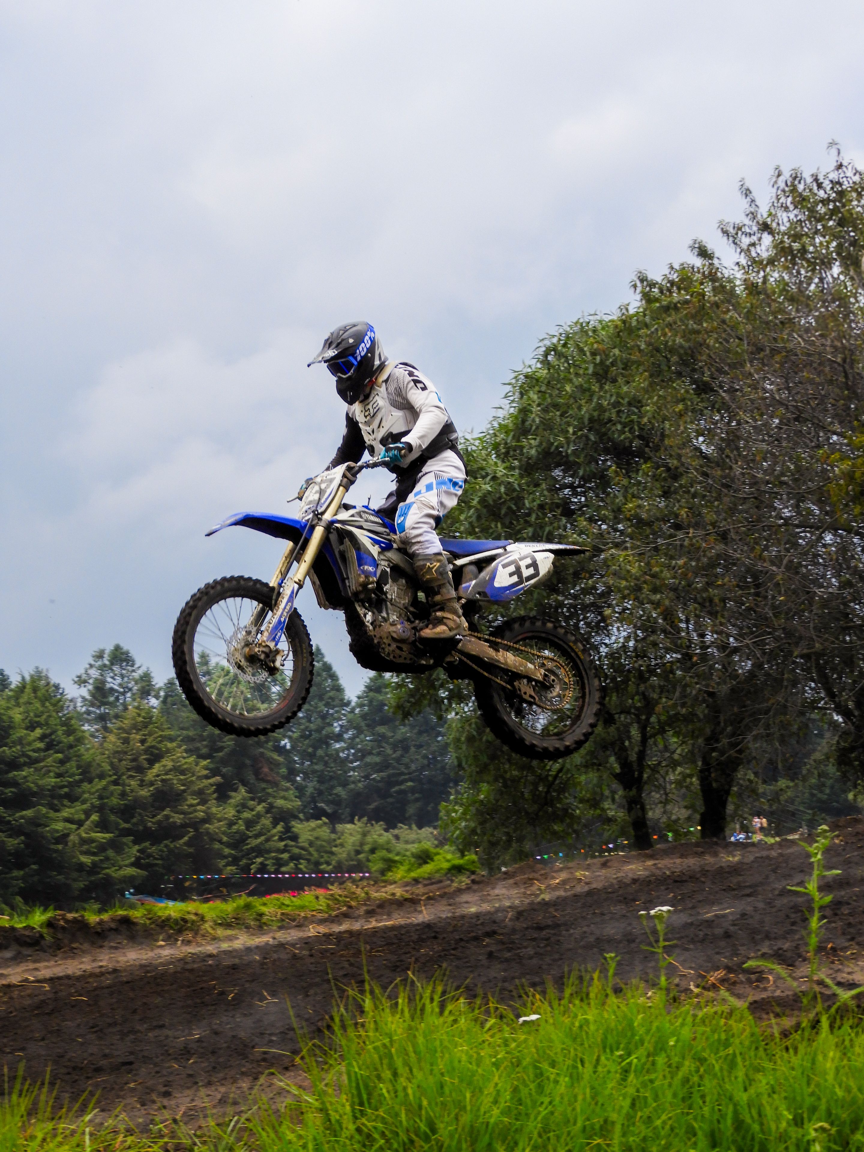 Exciting motocross action captured at La Marquesa with a rider in mid-air during a race.